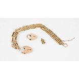 A 9ct gold gate link bracelet with heart form lock, safety chain, and a further heart form lock,