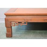 A late 19th/early 20th century Chinese hardwood low coffee table, with carved and pierced detail