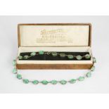 A silver and green agate necklace, boxed.