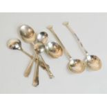 A group of three silver spoons and silver plate examples.