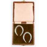 A pair of silver horseshoes, Sheffield, engraved Jean and Kenneth, in presentation box, 2.03toz