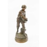 Henri Ple, boy sifting wheat, bronze signed to the base, 71cm high.