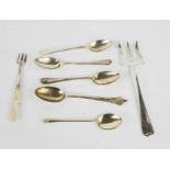 Five silver spoons, a silver and mother of pearl pickle fork, and a further fork, 2.91toz.