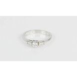 An 18ct white gold and diamond ring, with princess cut central diamond flanked by baguette cut