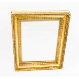 A 19th century giltwood wall mirror, with petal moulding, 75 by 58cm.