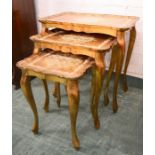 A nest of Italian giltwood tables, with poker work detail to the tops.