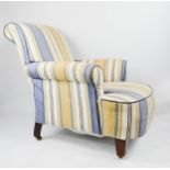 A Howard type 19th century armchair, in striped upholstery.