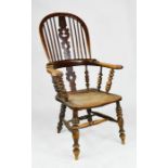 A 19th century elm Windsor armchair, with original residual dark red paint, with hoop back and