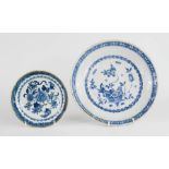 Two 19th century blue and white dishes, one depicting peonies 16cm diameter, and the other Delft