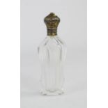 A French glass perfume bottle with white metal lid.