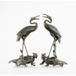 A pair of Chinese spelter groups: crane upon the back of a turtle, 23cm high.