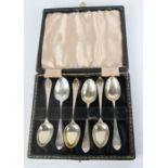 A set of silver spoons, London hallmark, engraved with monogram, boxed, 2.25toz.