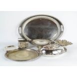 A group of silver plate ware to include one oval tray, a lidded tureen and other items.