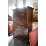 A late Georgian mahogany chest on chest, with two over six long graduated drawers, the upper section