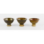 Three studio ware Japanese saki cups.