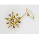 A yellow metal starburst brooch, set with amethyst, and seed pearl brooch with safety chain, 2.6g.