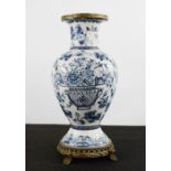 A Chinese blue and white vase, with metal base and rim, A/F, 34cm high.