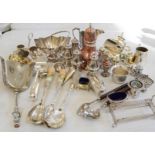 A group of silver plate ware to include salad servers, salt and pepper pots, sandwich tongs etc.