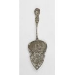 A white metal Dutch 19th century cake slice, pierced and engraved with decoration.