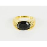 A 9ct gold and paste oval ring, size O, 9.7g.