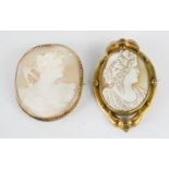 Two cameo brooches, one set in yellow metal.