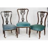 Three Edwardian mahogany bedroom chairs, with blue upholstered seats, and pierced and carved