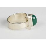 A silver Scandinavian ring with emerald coloured cabochon, stamped Finland.