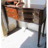 A four drawer sideboard.