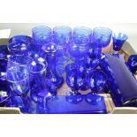 A group of Bristol blue glassware, some Mid Century, including wine glasses, vases and other
