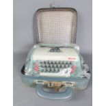 A Petite typewriter in case.