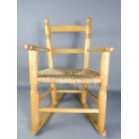 A Child's rocking chair with rush seat.