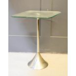 A designer glass and brush chrome side table, with diamond form glass top.