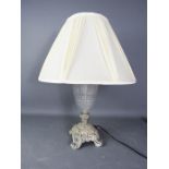 A glass and French style table lamp.