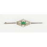 An Art Deco platinum, emerald and diamond bar brooch, 4.7g.