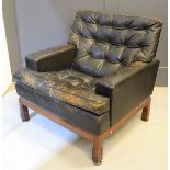 A Mid-Century 1950s black leather armchair, with buttoned back and seat cushion.