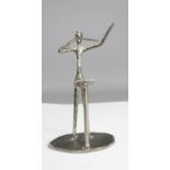 A metal ornament in the form of an conductor, made in Scotland by the Mchail Collection.