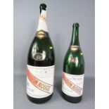 A GH Mumm magnum champagne bottle and one smaller example. (no contents)
