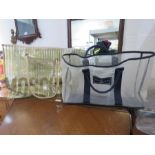 A Moschino bag and a Ralph Lauren beach bag.
