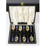 A set of six Art Nouveau silver and enamel spoons, Birmingham, in original box.