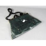 A green leather vintage handbag, together with a key and perfume bottle.