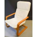 A Habitat beech and cream lounger chair.