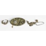 A silver studio designed brooch together with two silver pieces of jewellery in the form of vine and