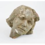 A mid-century reconstituted stone head of a young girl.