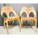 A pair of Mid-Century designer chairs.