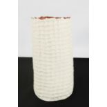 A white Studio vase, with red glazed interior.