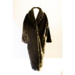 A faux fur full length coat by Forge-a-Head.
