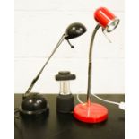 A red desk lamp with articulated head, and a black Ikea desk lamp.