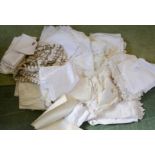 A group of linen, to include table cloths, napkins, hand woven examples.