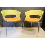 A pair of Max Design Italian chairs, by Zed Hannes Wettstein, in green and orange.