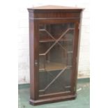 A mahogany corner cupboard, with astrigal glazed door.